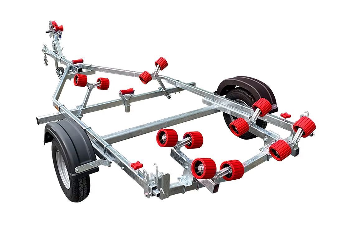 Boat trailer with red rollers, gray metal frame, black fenders, and wheels.