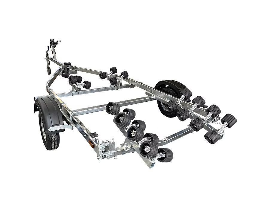 Boat trailer with black wheels and multiple rollers on a white background.