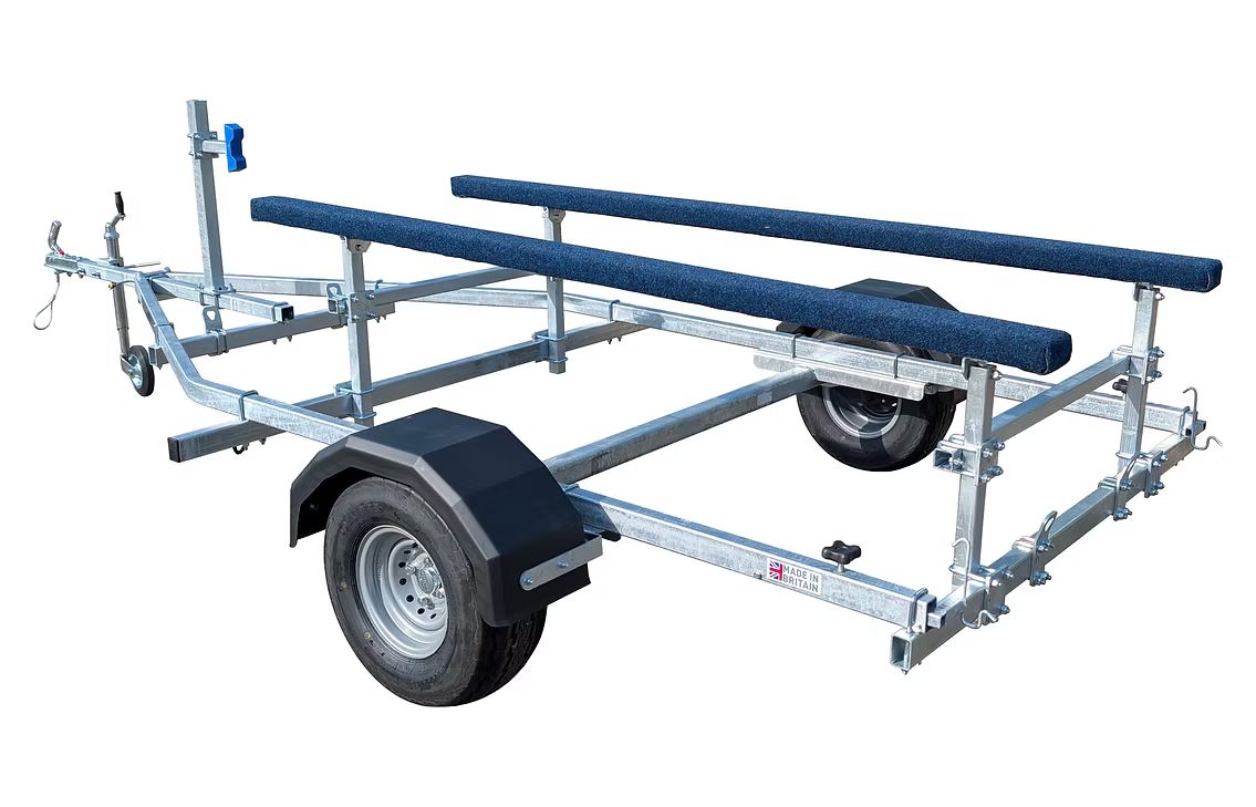 Boat trailer, with blue padded rollers, and a black fender, on a white background.