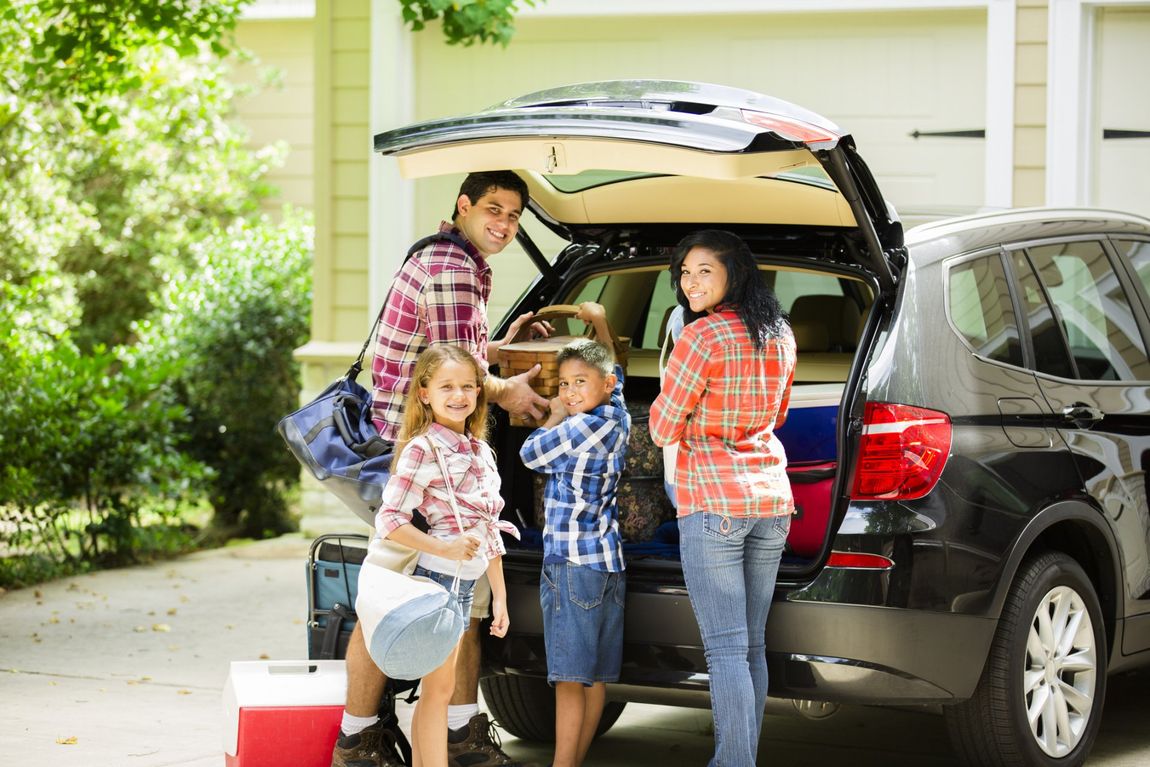 Family Inserting Things Inside Car - New London, CT - Action Auto Insurance Agency Inc.