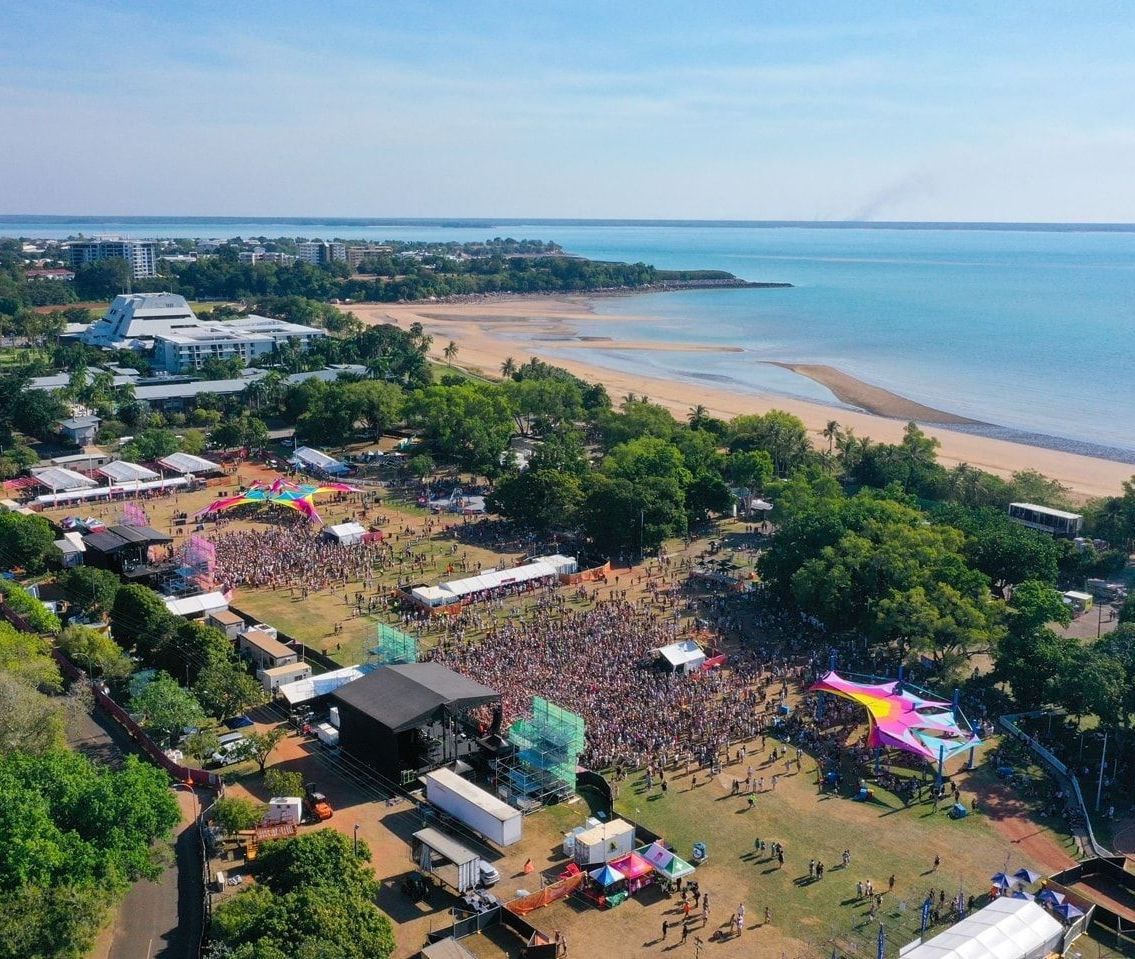 An aerial view of a large crowd of people at a festival.