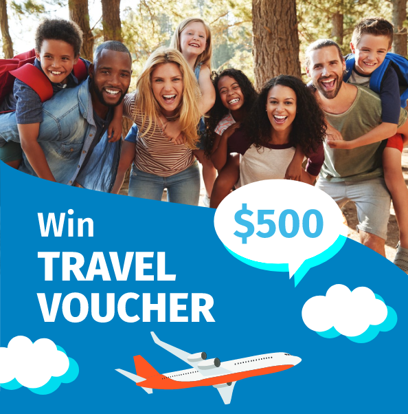 A group of people posing for a picture with a $ 500 travel voucher