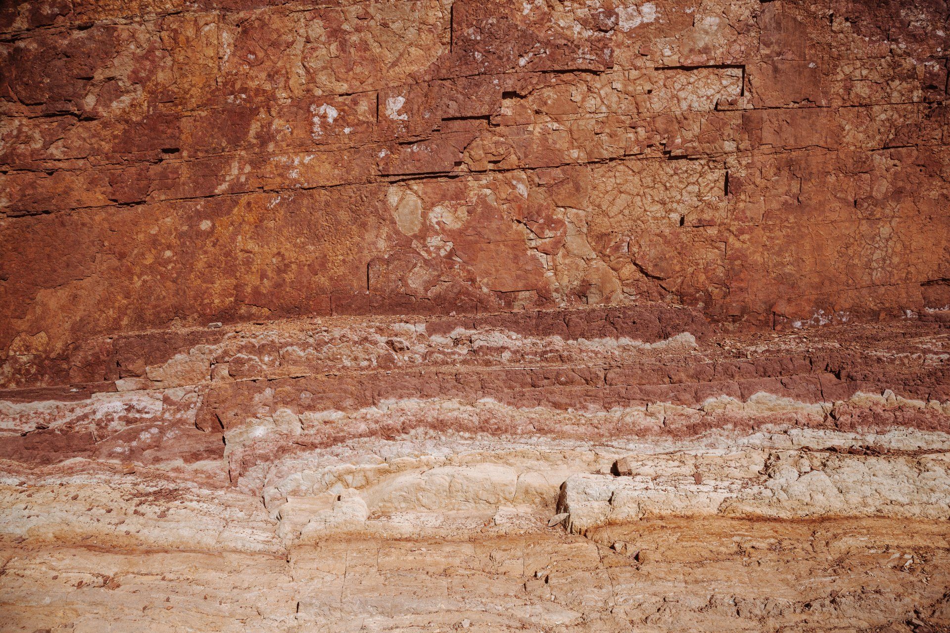 A close up of a brick wall with a lot of dirt on it.