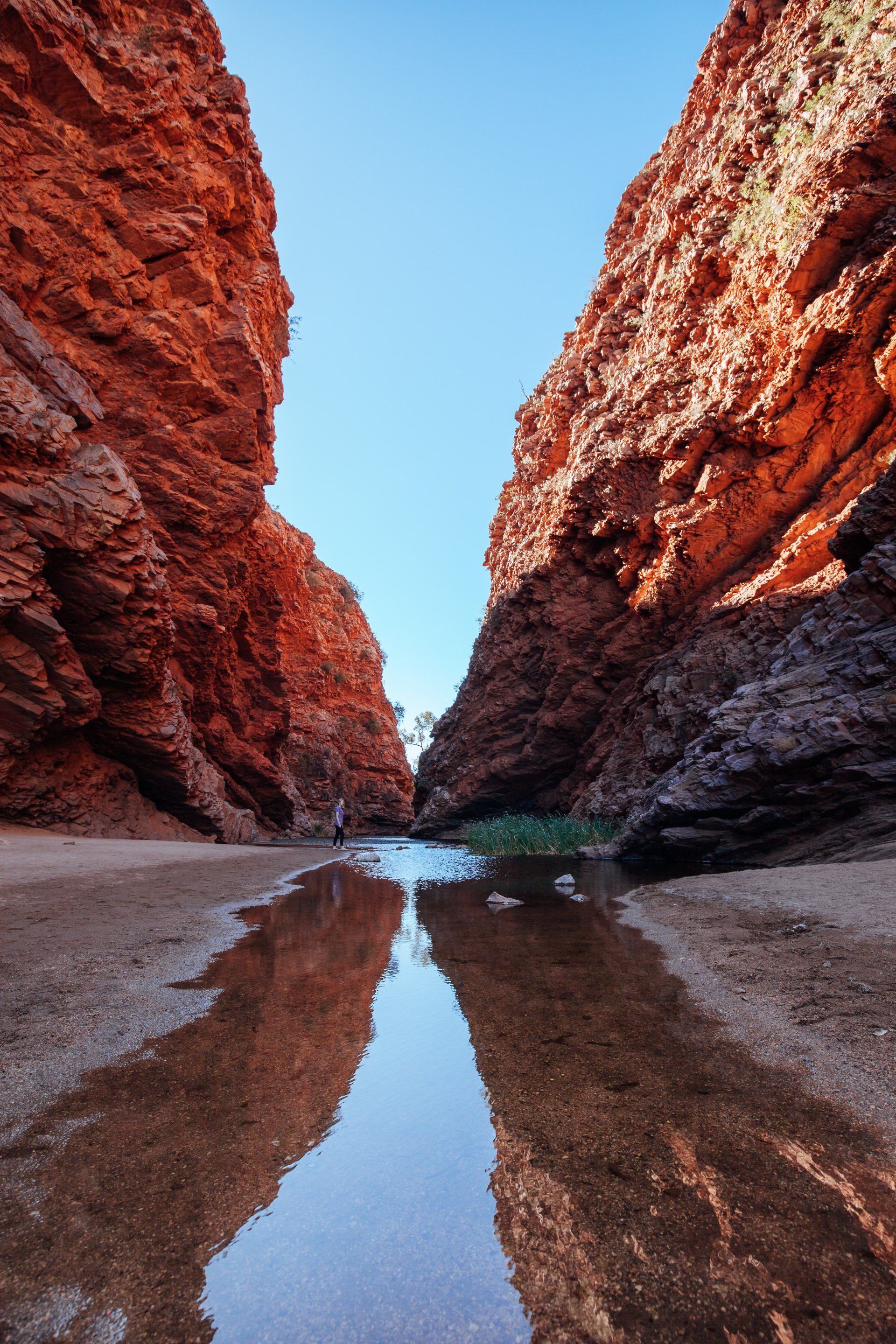 There is a river in the middle of a canyon.