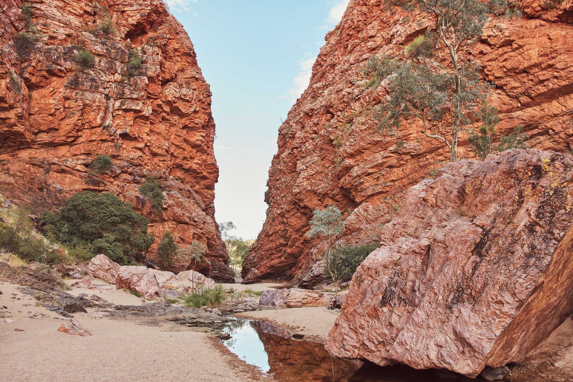 A river runs through a canyon between two rocky cliffs.