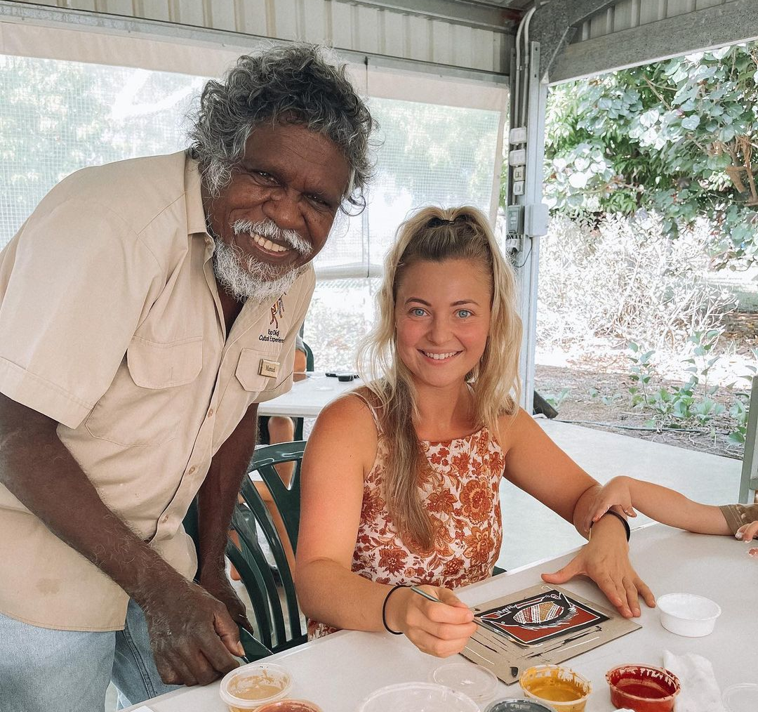 A man and a woman are sitting at a table.