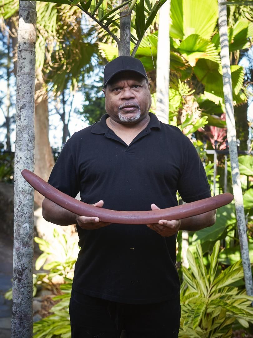 A hotel room with two beds and a window.