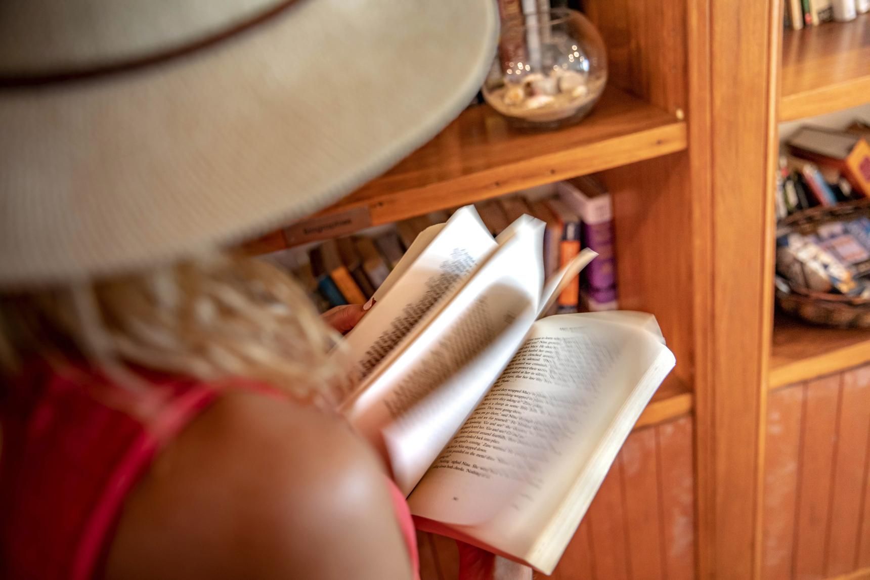 A hotel room with a bed , couch , desk and television.