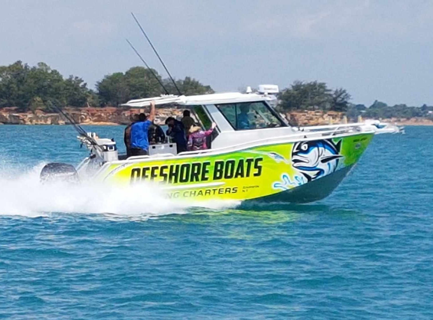 A boat is floating on top of a body of water.