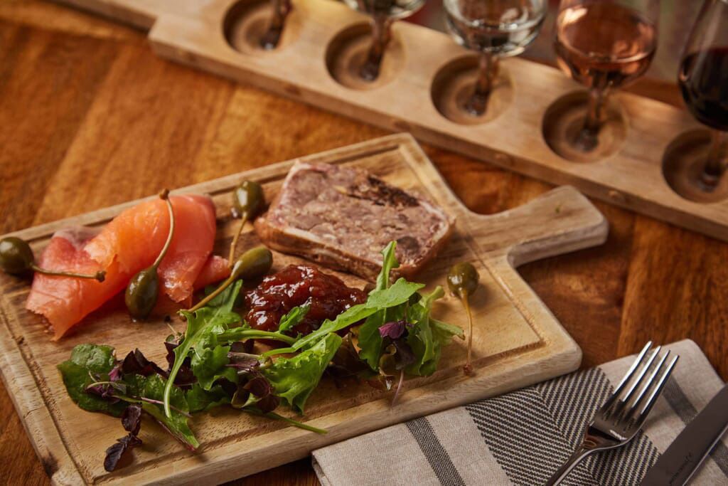 charcuterie board served in the Three Choirs brasserie, featuring local meats and cheeses – perfect for a romantic dining experience