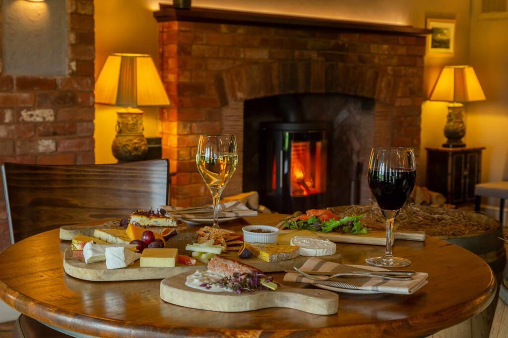 Intimate private dining table set with a view of the vines at Three Choirs Vineyards
