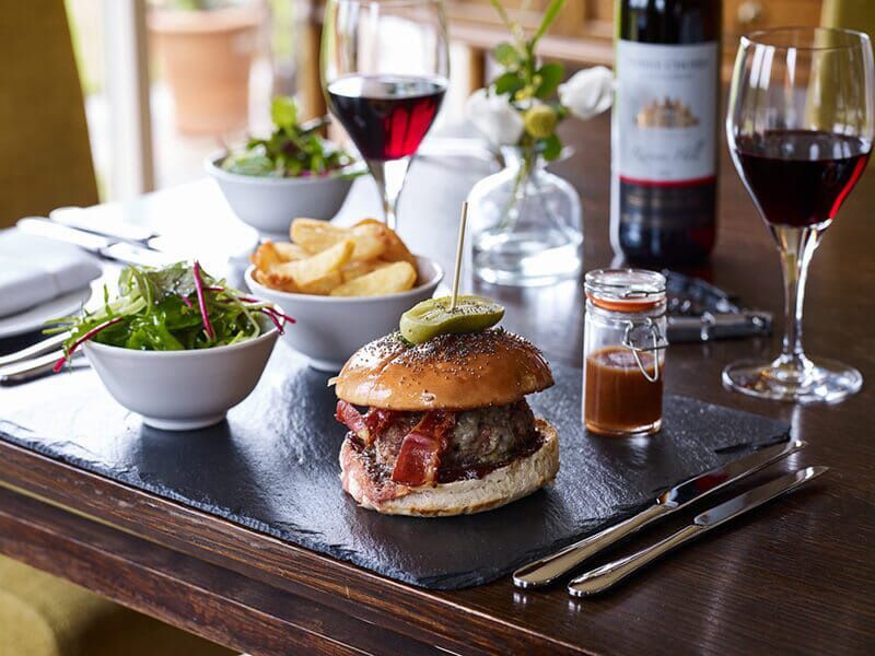 Guests enjoying seasonal dishes with wine pairings at the Three Choirs Vineyards brasserie
