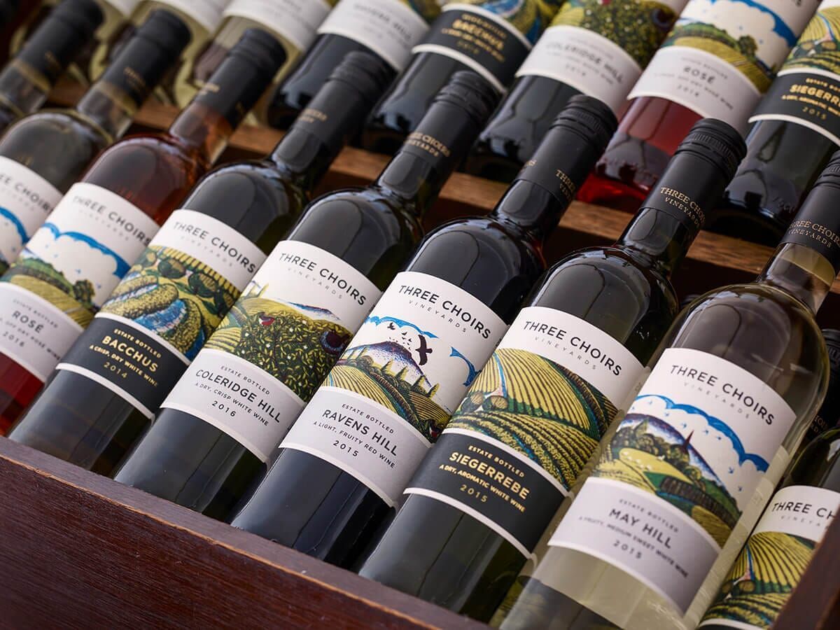 several bottles of wine are lined up in a row