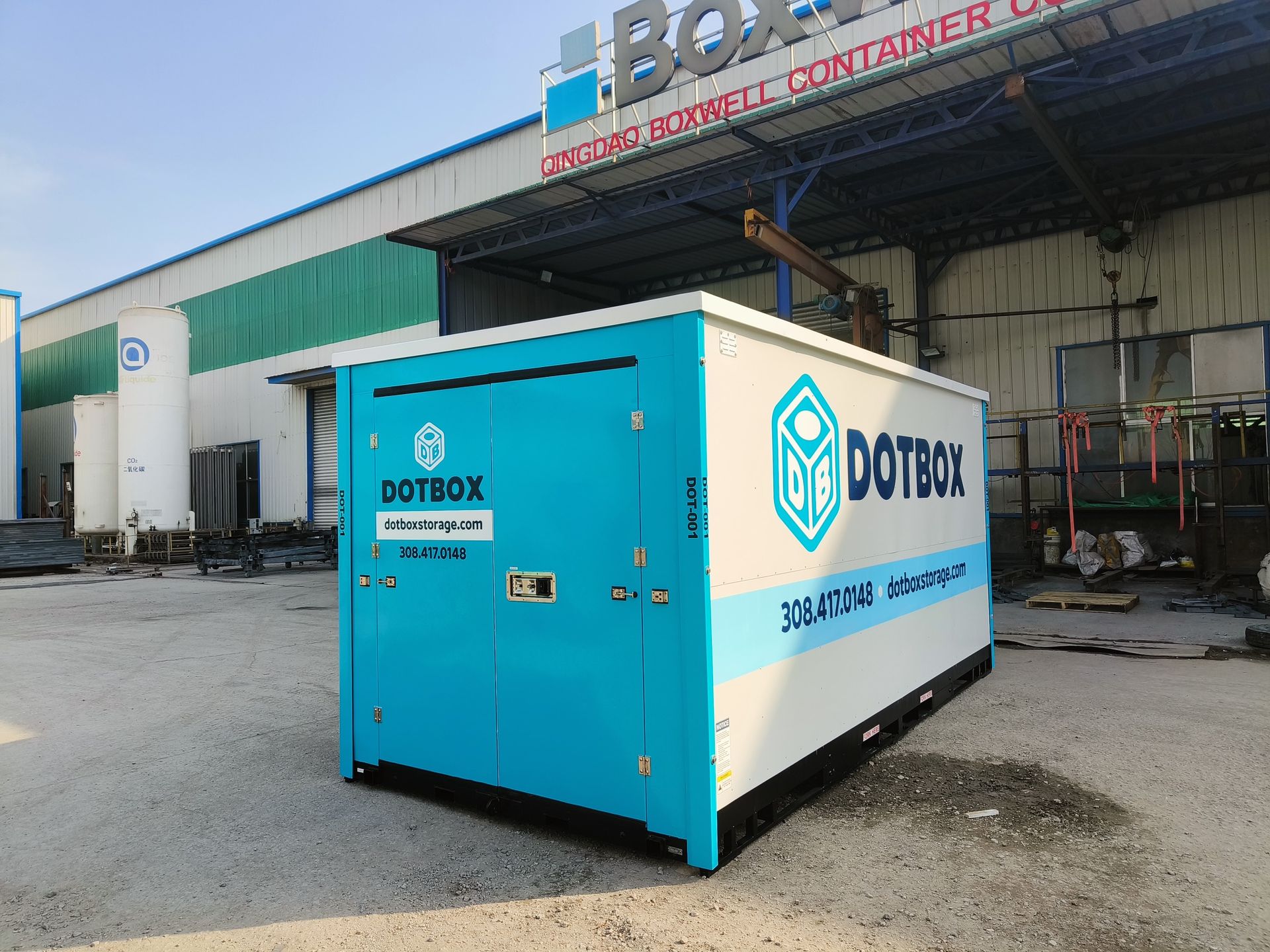 A blue and white mobile storage box with the word dotbox on it
