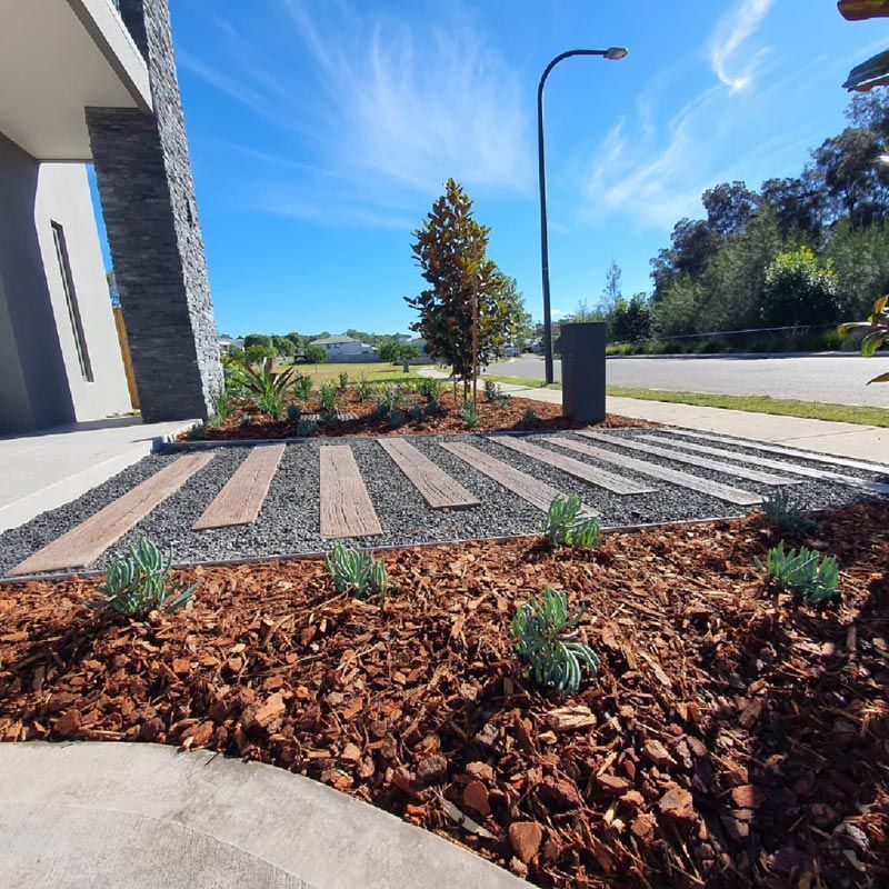 A Landscape With A Concrete Walkway — Green Envy Landscape & Garden Services In Cameron Park NSW