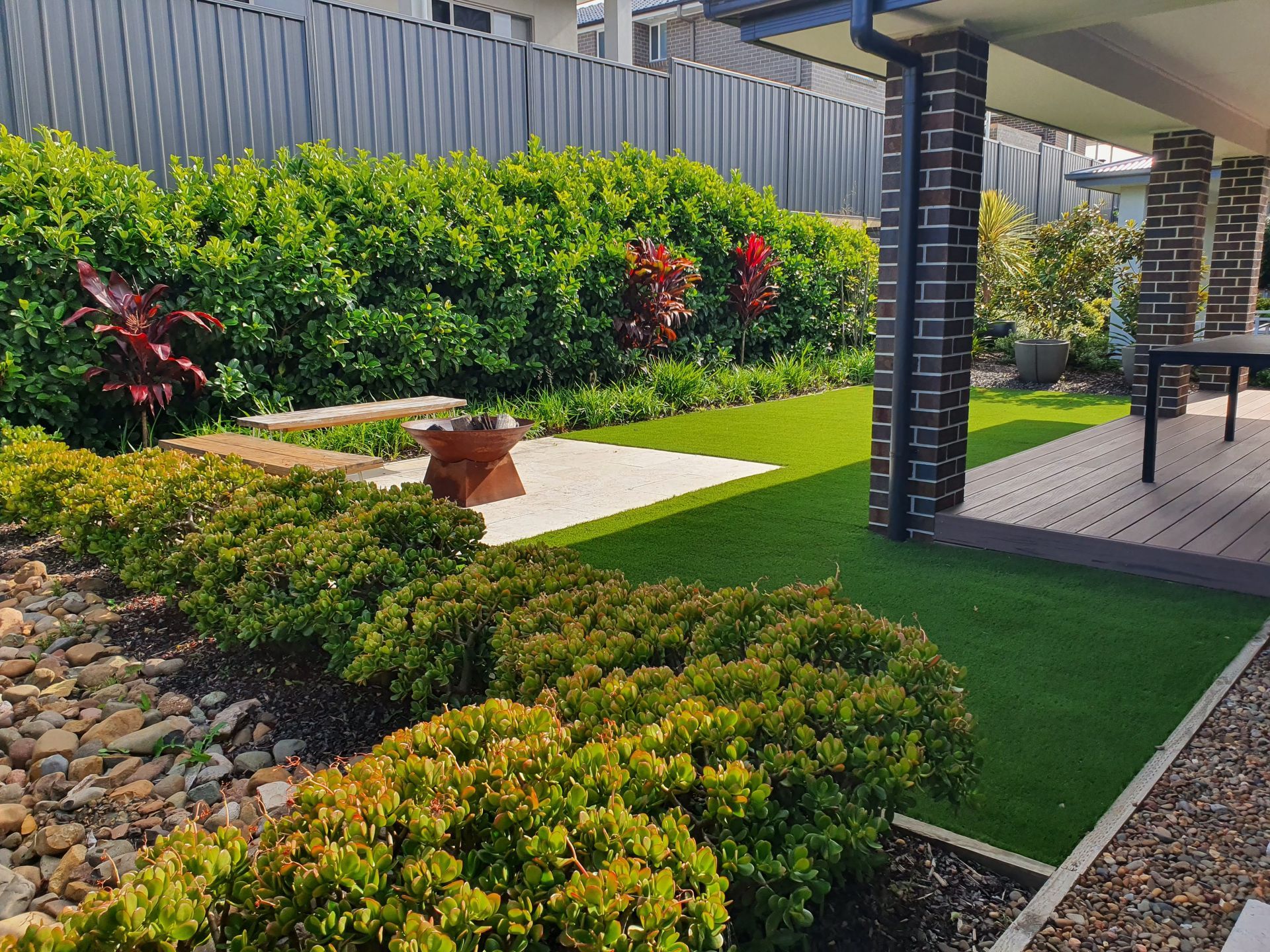 A Walkway Leading To The Front Door Of A House — Green Envy Landscape & Garden Services In Cameron Park NSW