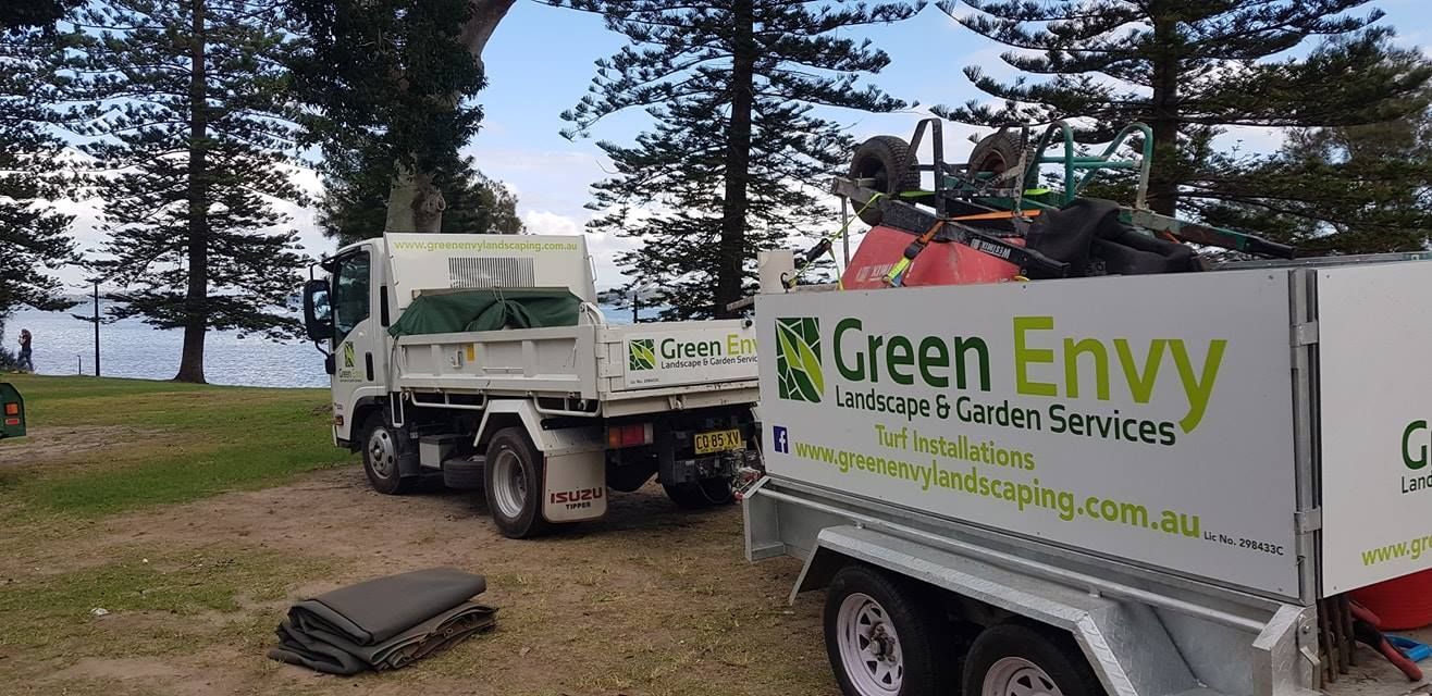 A Large Lush Green Lawn With Trees In The Background — Green Envy Landscape & Garden Services In Cameron Park NSW
