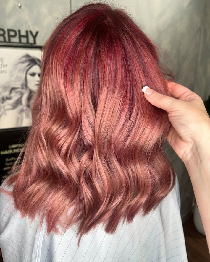 A Woman With Red Hair is Standing — AW Hair Studios - Surfers Paradise in Surfers Paradise, QLD