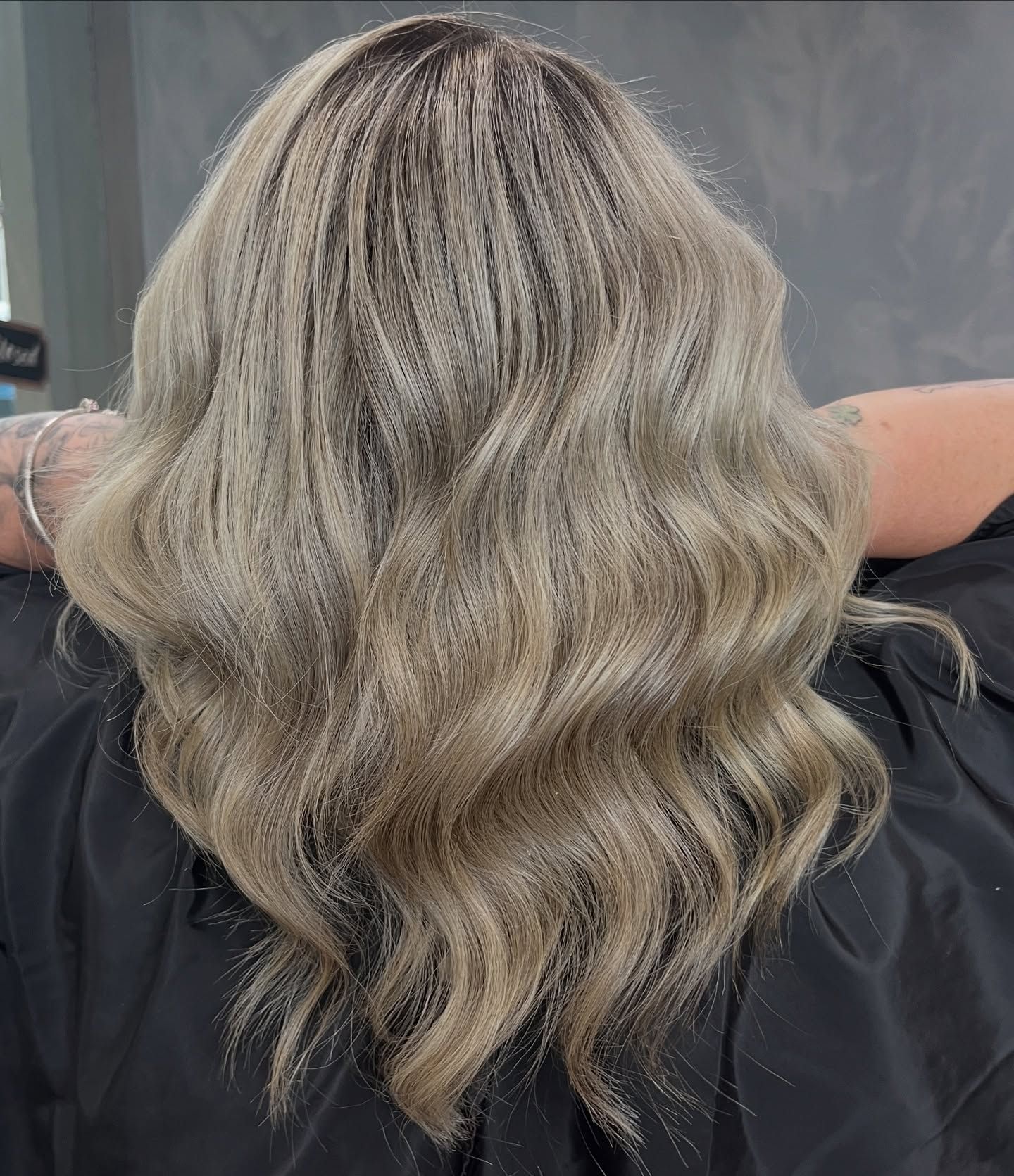 A Woman With Long Wavy Brown Hair — AW Hair Studios - Surfers Paradise in Surfers Paradise, QLD