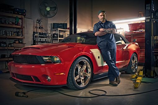 Mechanic Posing On Sports Car — Metairie, LA — Bert's Auto Repair