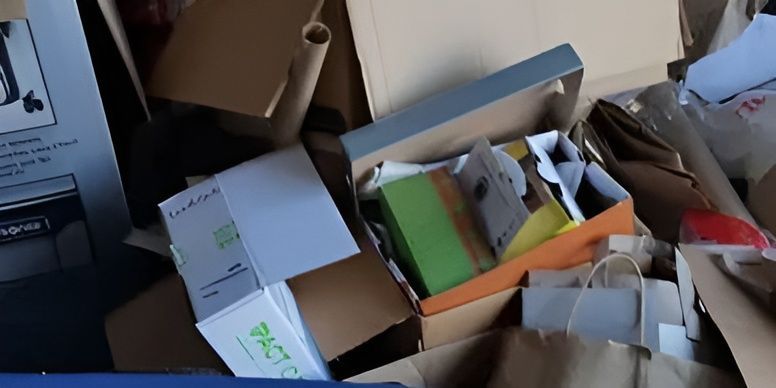 A pile of cardboard boxes with one that says ' europe ' on it