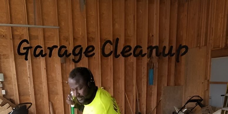 A man is standing in a garage with the words `` garage cleanup '' written on the wall.