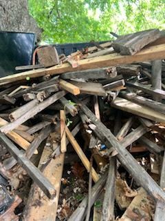 A pile of wood is sitting on top of a pile of wood.