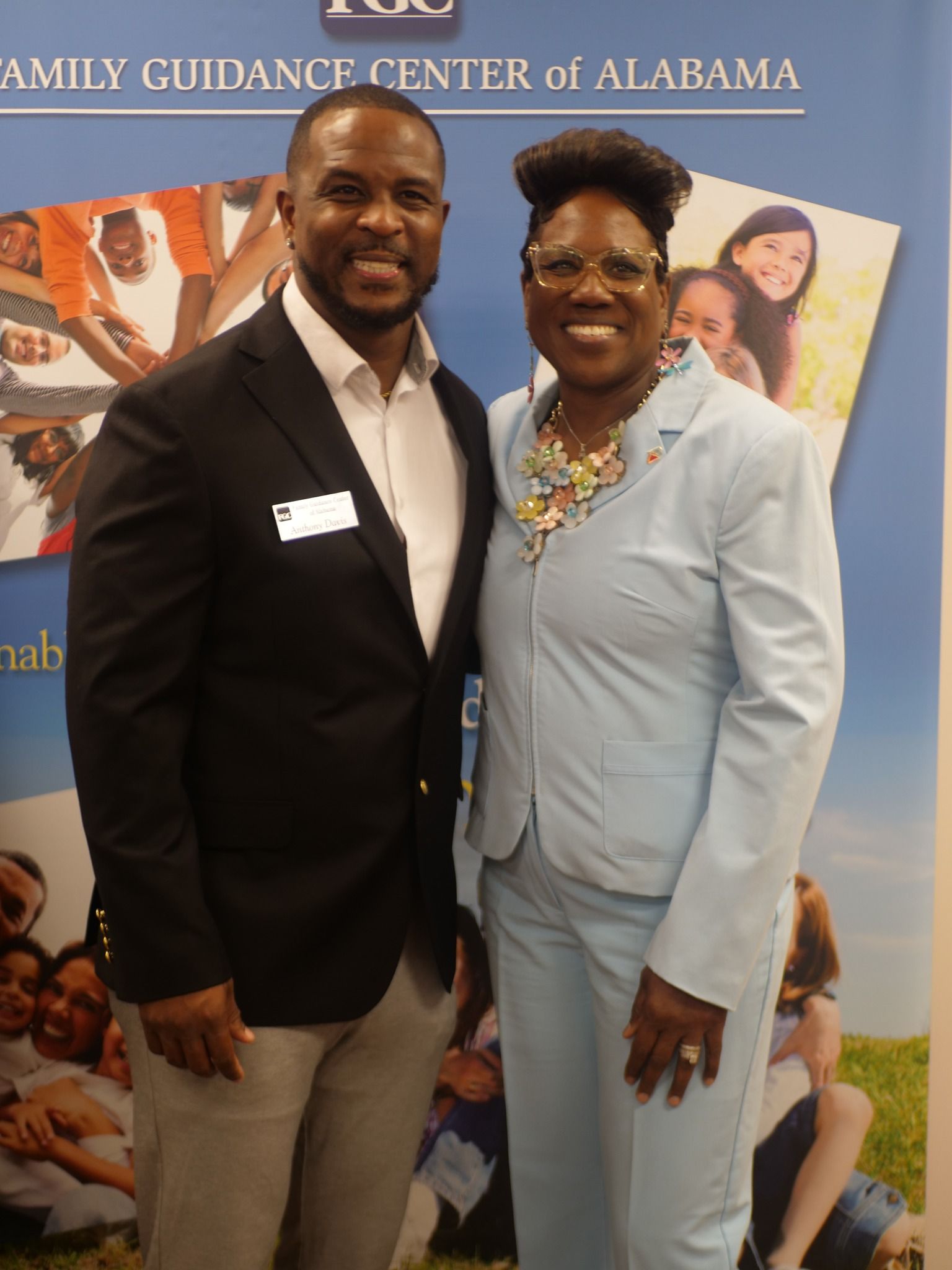 A group of people are posing for a picture in a room.