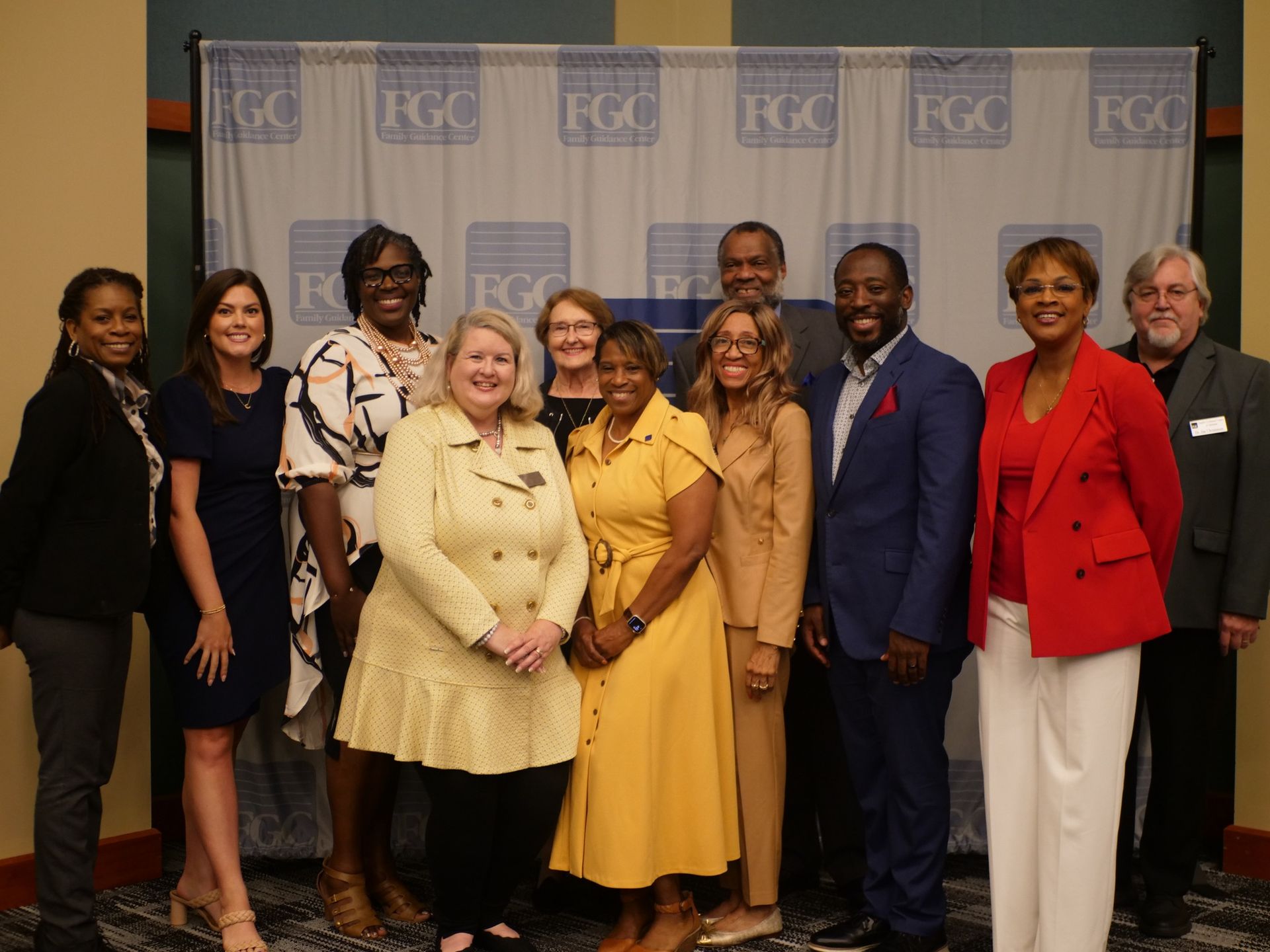 A group of people are posing for a picture together.