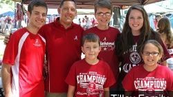 A group of people wearing red shirts are posing for a picture.