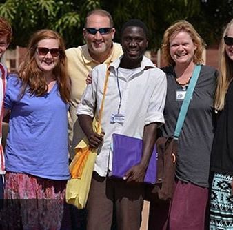 A group of people are posing for a picture together.