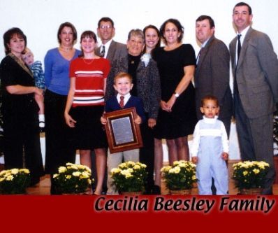 A group of people posing for a picture with the name cecilia beesley on the bottom