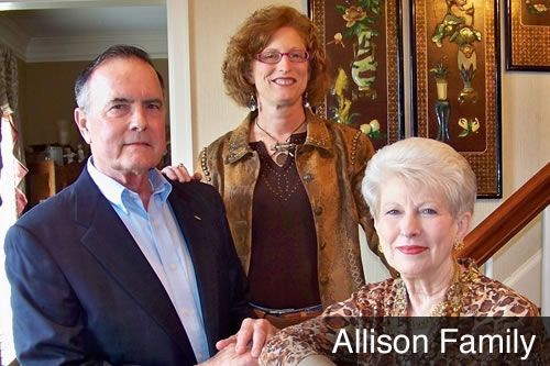 A man and two women are posing for a picture with the caption allison family