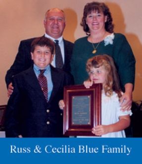 Russ and cecilia blue family posing for a picture