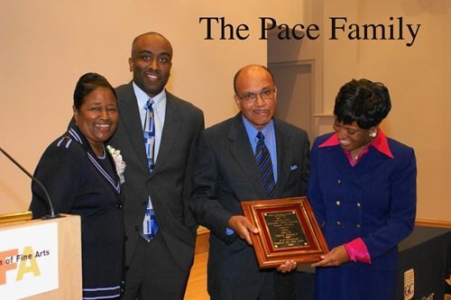 A group of people posing for a picture with the words the pace family behind them