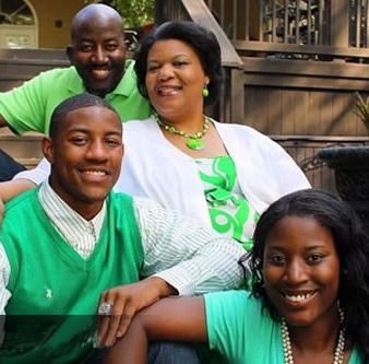 A group of people are posing for a picture and one of them is wearing a shirt that says no