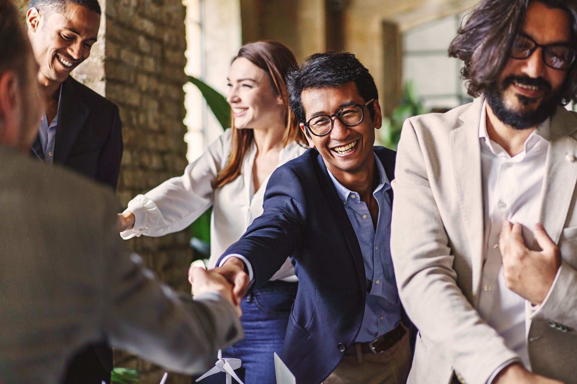 business people in a gathering shaking hands