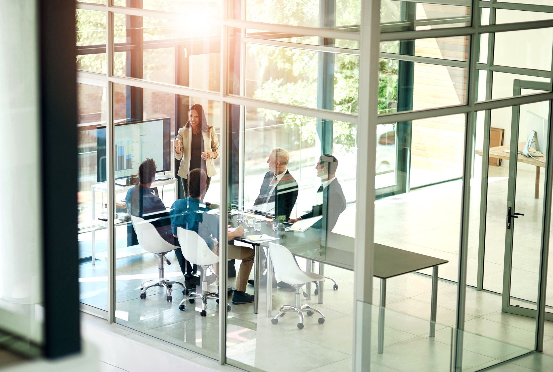 A group of people are having a meeting in a conference room.