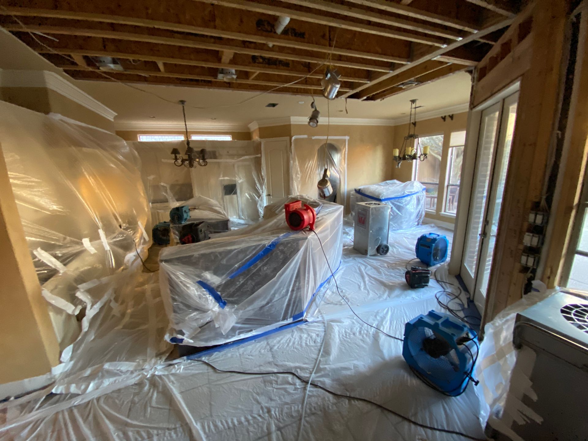 Interior of a room undergoing water damage remediation.