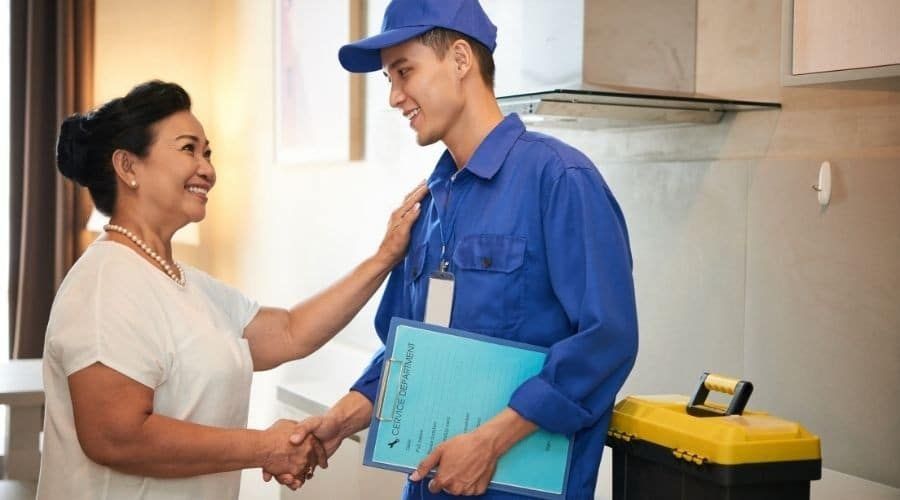 plumber and client shaking hands