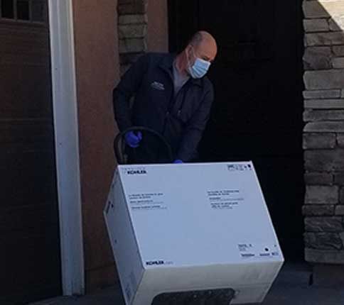 man carrying box for plumbing