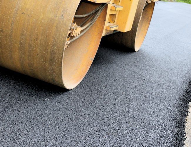 paving machine smoothing asphalt