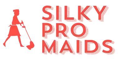 Logo for Silky Pro Maids featuring a red silhouette of a person sweeping next to the company name in red text.