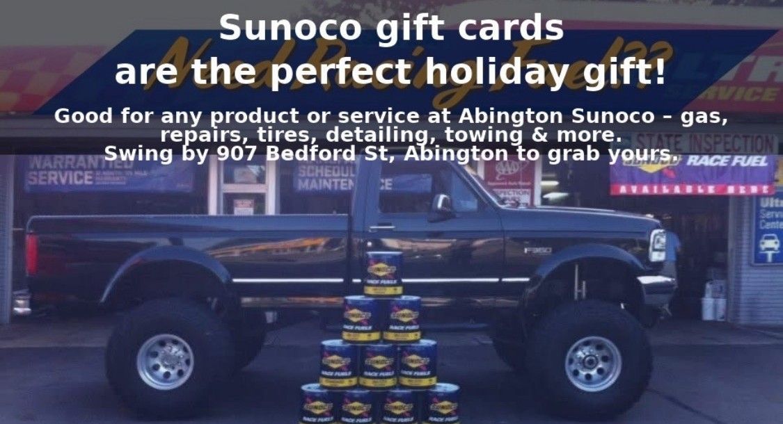 A black monster truck with gift card advertisement for Abington Sunoco.