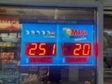 A gas station with a sign that says `` mega million '' on it.