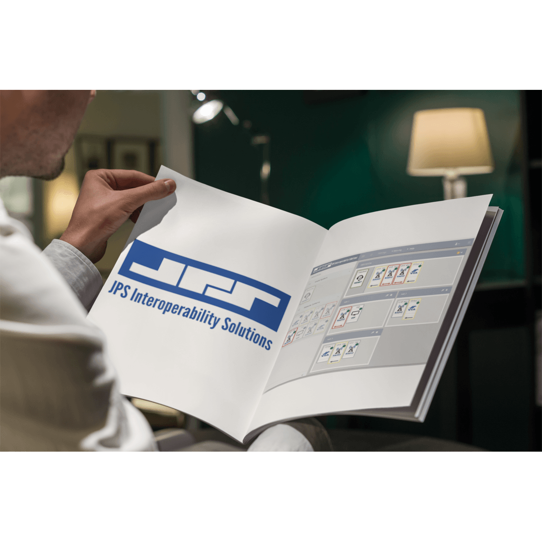 A man is sitting on a couch reading a book.