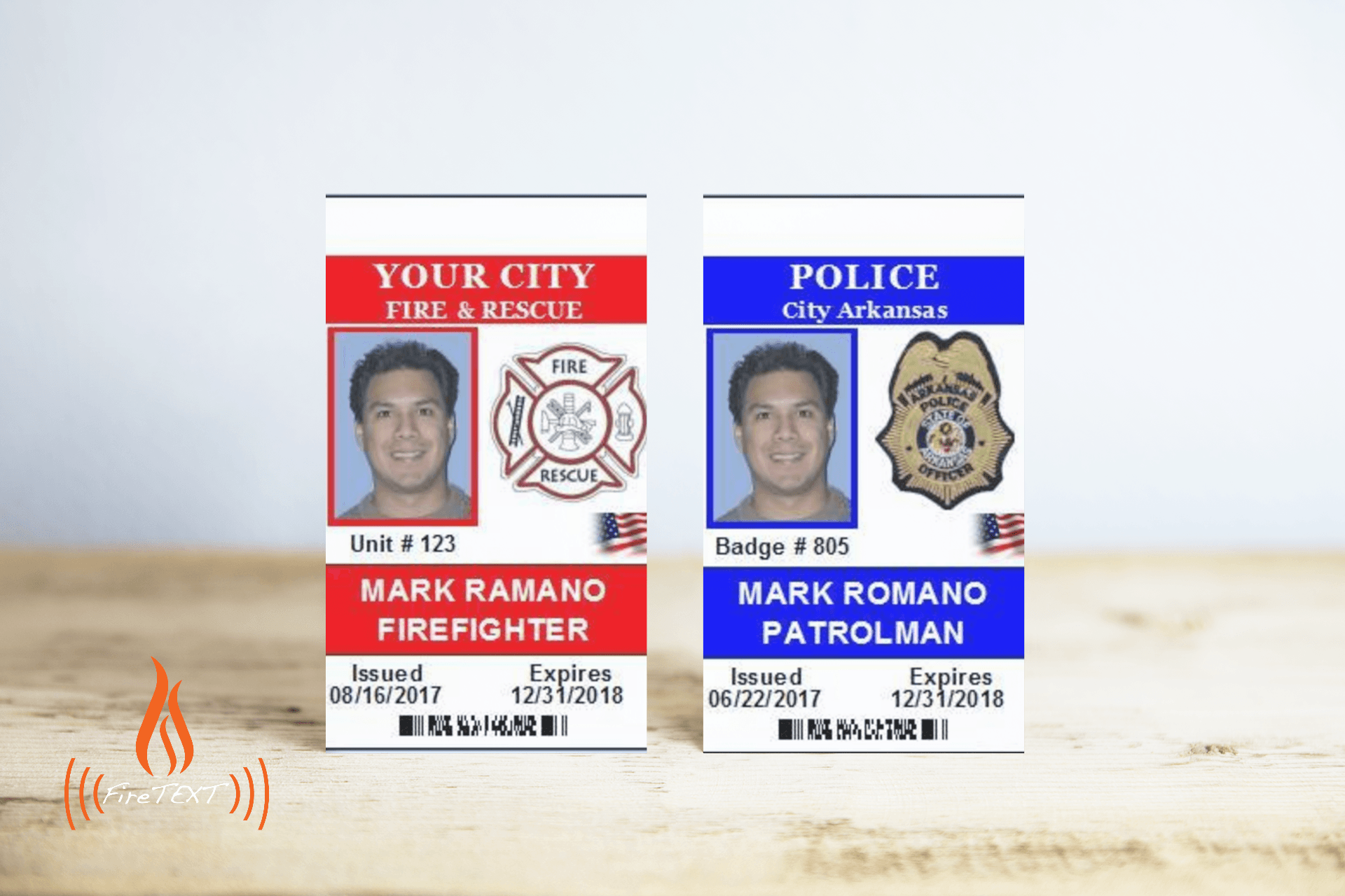 A firefighter and a police badge are on a wooden table.