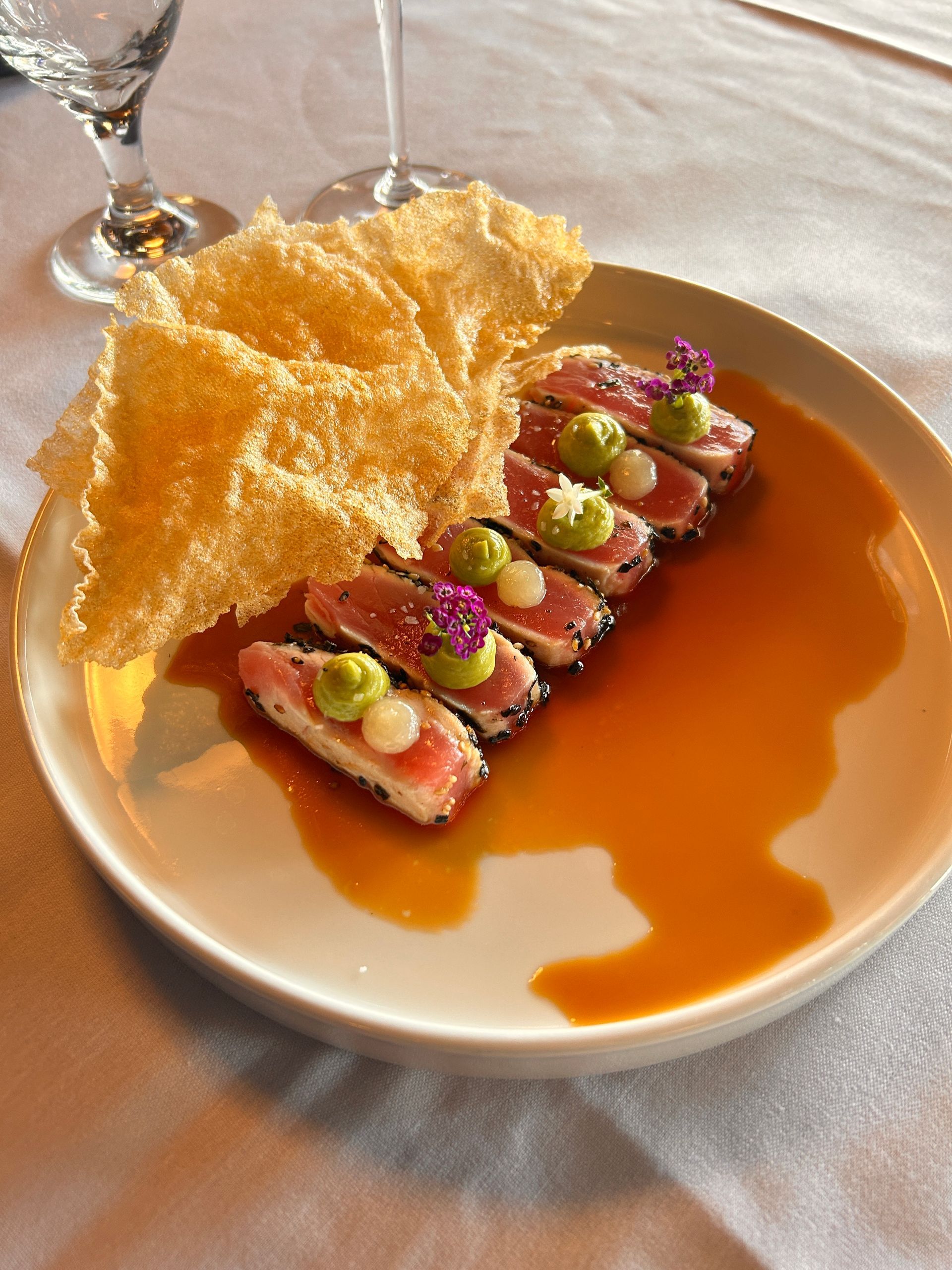 A white plate topped with a steak and shrimp