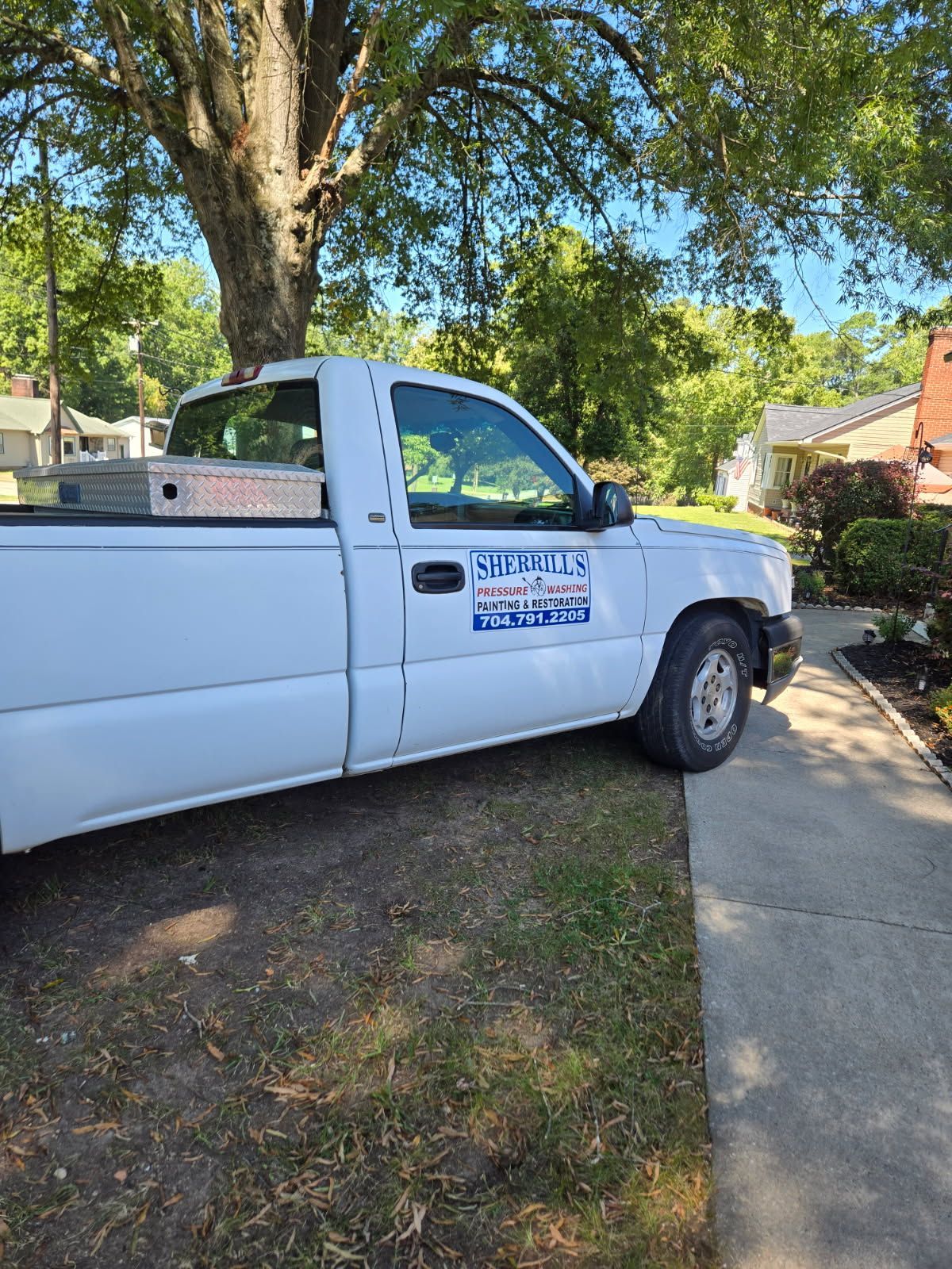 A close up of a roof with rain falling on it.