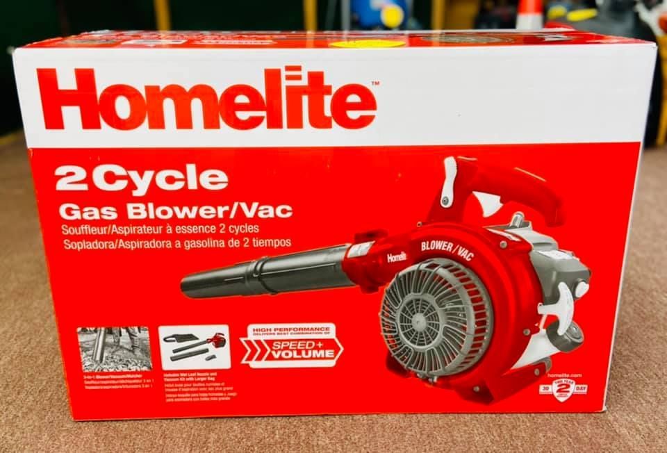A red and white homelite 2 cycle gas blower / vac